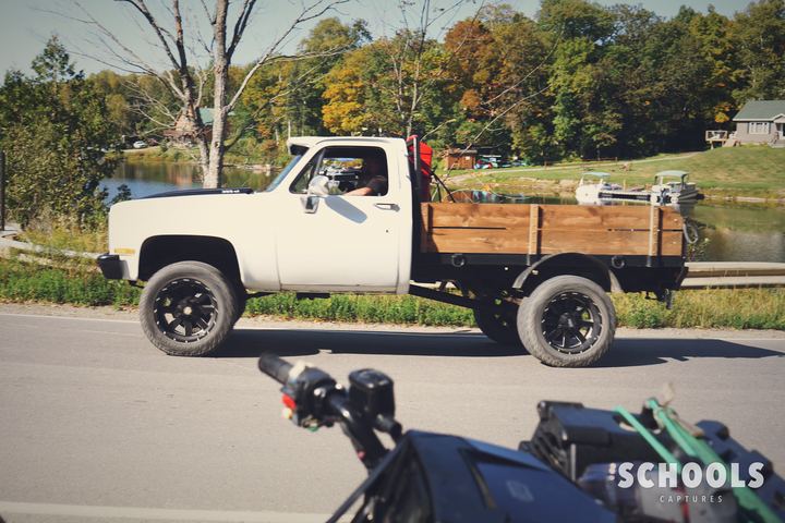 White flatbed with wood rails